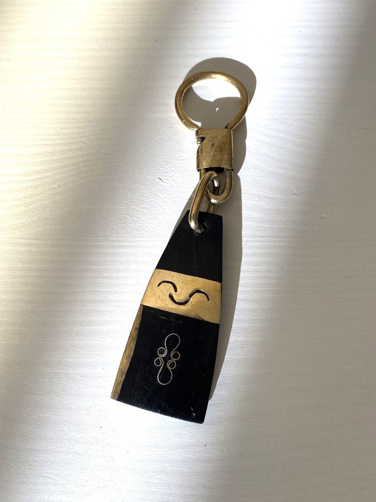 Handcrafted Afro keychain - ebony wood and brass - Trapezoid shape